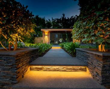 Illuminated step leading to cabin at night. product photography