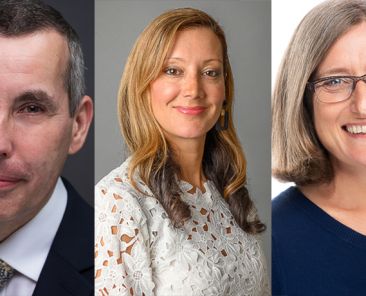 Side by side shot of three people in front a dark background, a grey one, and a white one.