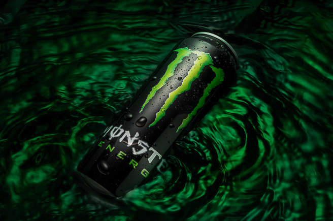 Black can floating in green water